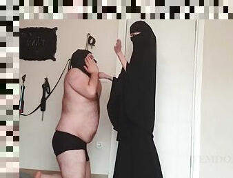 Muslim mistress caning a fat slave