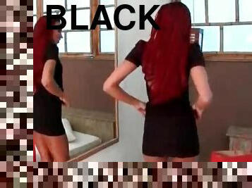 Latina redhead models a tight black dress