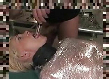 Sexy blonde in plastic wrap has her pussy played with
