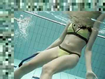 Girls swimming underwater and enjoying eachother