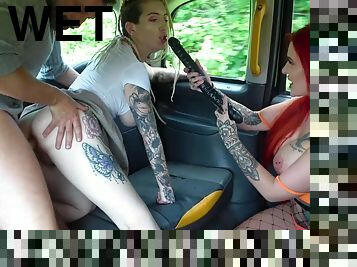 Two nasty sluts get fucked hard in the backseat of a car