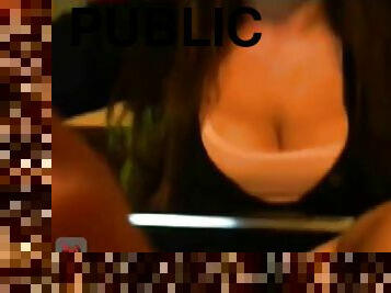 Big boobed chick flashes in a public pub