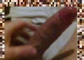 Jerking off uncut cock and cumming in bed