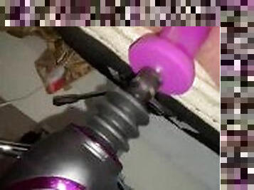 Teen uses dildo machine during work