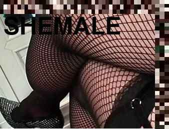 Emmanuel in the video wearing fishnet stockings