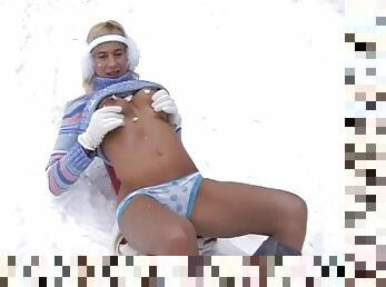 Busty teen Yvonne toys pussy in the snow