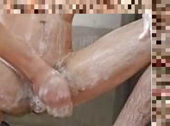 Solo male undressing and soapy shower