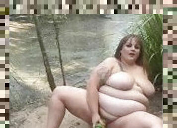 Nude BBW in nature finds a swamp monster and lets it slide in