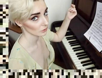 Piano playing British girl has her small tits exposed