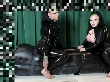 Finnish Goth Girls playing with a Slave in inflatable rubber sleepsack-Breathplay & Teasing