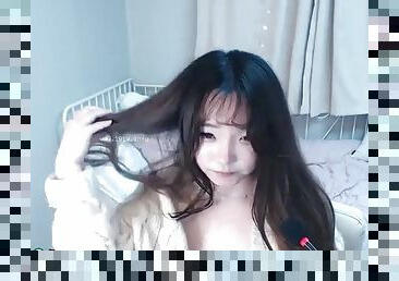 Horny busty Asian camgirl masturbates