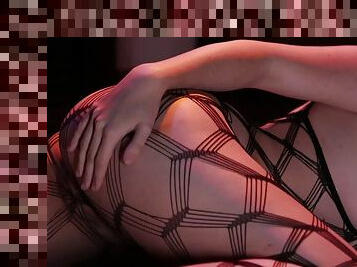 Woman in fishnets rubs her pussy until she comes hard