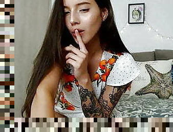 Sexy webcam girl moaning of pleasure in a sweet dress