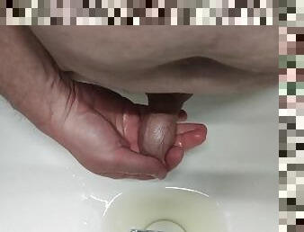 Pissing into the sink and into the foreskin