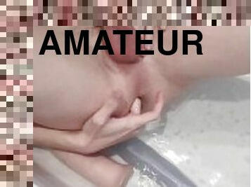 boy plays with dildos in his bath