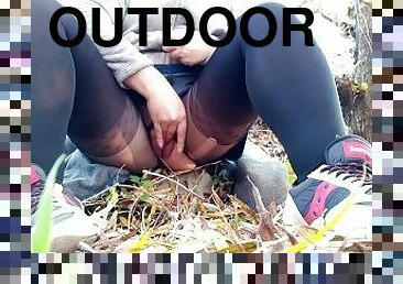 Masturbating outdoors in nylon pantyhose with a hole in the pussy