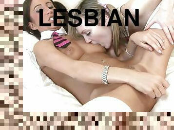 Playful lesbian teens lick a lpop before licking each other