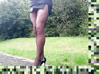 Outdoor office mini skirt and black pantyhose .