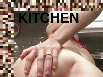 Brunette with red bra masturbating in kitchen