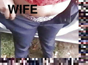 Wife changes trousers at roadside