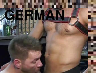 Two sexy German hunks meet at a gay cruising bar and have raw rough sex