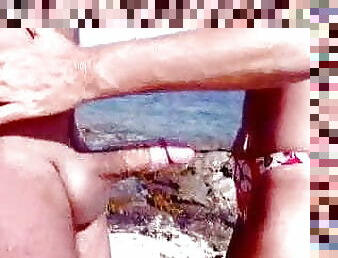 Grandma&#039;s handjob on the beach.