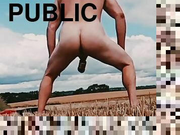 Fat cock and ball weights naked in corn field