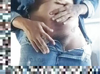 Venezuelan boy in Blue Jeans touching is balls