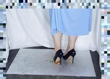 Candy crushed under her sexy black patent heels