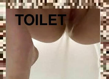 Squatting peeing on toilet seat