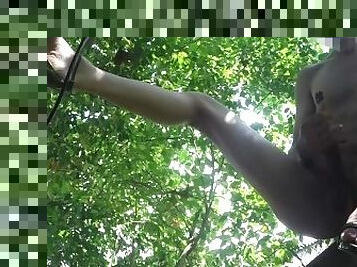 outdoor masturbation in a treehouse, maybe caught by the neighbors