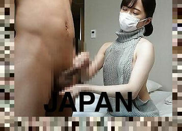 Japanese girl give a guy a handjob wearing sexy sweater