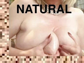 oiling my 34h all natural tits