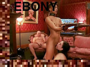 Nikki Darling In Ebony Slave Holding Heavy Padlocks
