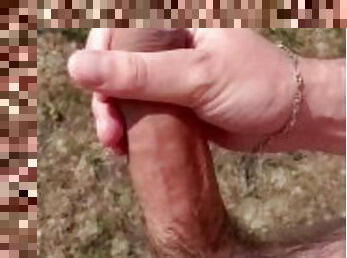 Jerking my big cock in the countryside with cumshot