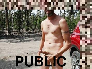 Scruffy Tattooed Guy on a Public Forest Road