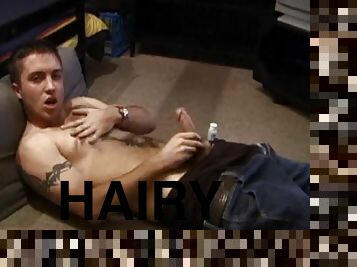 Johnny Johnson takes off his shirt and starts a porn video. Baring his hairy chest, this young man puts his hand inside his jeans and massages his ...
