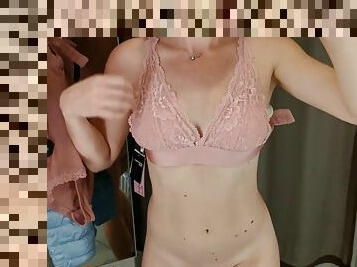 The girl tries on beautiful lingerie