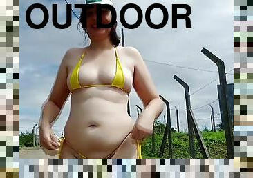 She walks outside in a micro bikini for many workers.