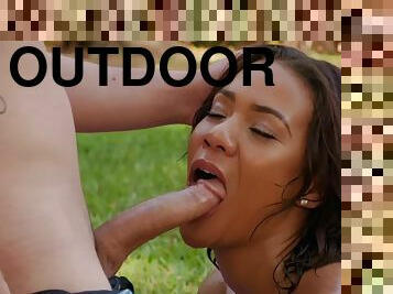 Brown skinned hottie London Tisdale takes a white cock outdoors