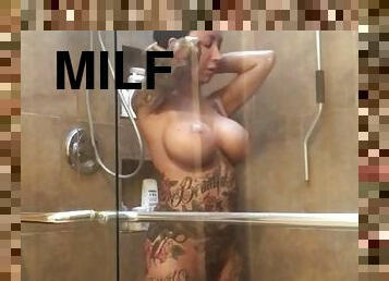 Tattooed mom in shower gets wet - Big fake tits