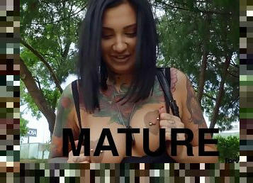 Tattooed mature Adel Asanty gets fucked in suburbia