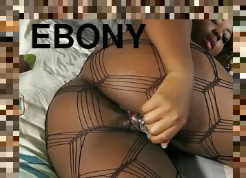 Hot ebony Deziree Monroe shakes her huge ass and gets her tight pussy wet with her glass dildo