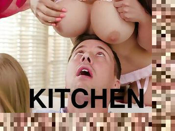 Horny dude fucks two insatiable hotties in the kitchen