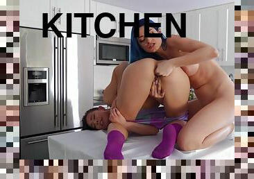 Two astonishing young babes make love in the kitchen