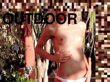 Teenager teases in her panties outdoors