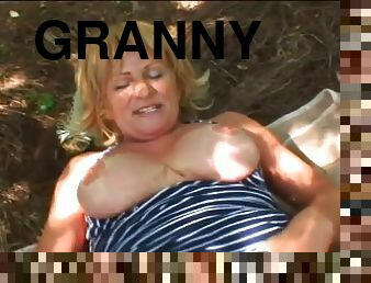 A nasty big tit blonde granny sucks hard cock in the forest and gets it in her pussy