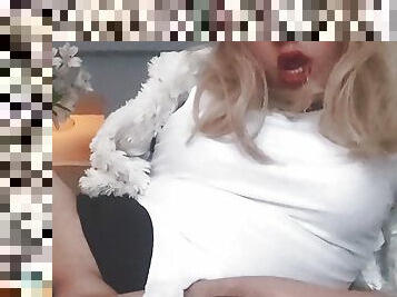 Sexy sissy crossdresser in chastitty on sofa