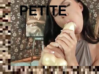 Petite girl sucks big dildo and masturbates