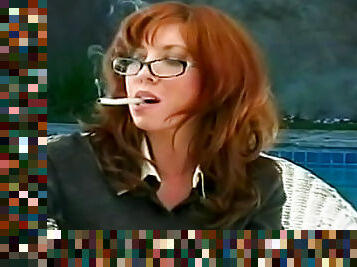 Redhead babe is smoking a cigarette so sexy